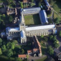 aerial photograph of Norwich Cathedral , Norfolk, England UK. Construction of Norwich Cathedral lasted 49 years from 1145 to 1145. Since then the Spire has been partially rebuilt in medieval times but the building is largely unchanged from the last renovation in 1480.The 315 ft spire is the second tallest in England